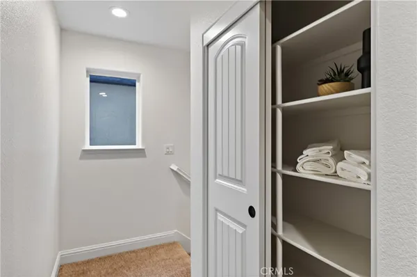 a view of bedroom with hallway