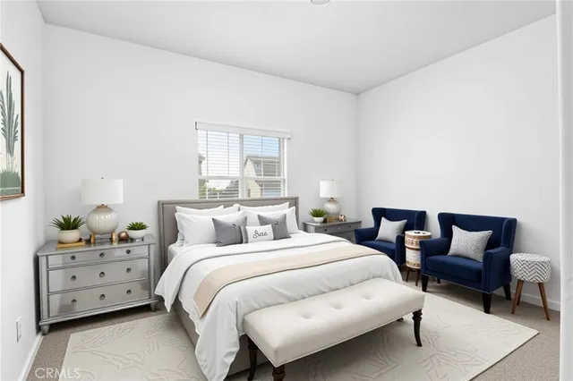 a bedroom with a bed and a couch