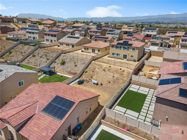 an aerial view of a house with a garden