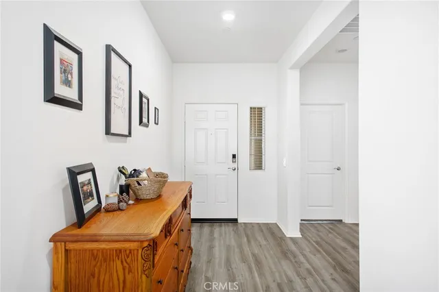 a room with a chair and wooden floor