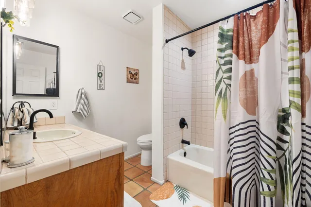 a bathroom with a sink a bathtub and a shower