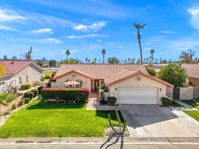 a aerial view of a house with a garden and plants