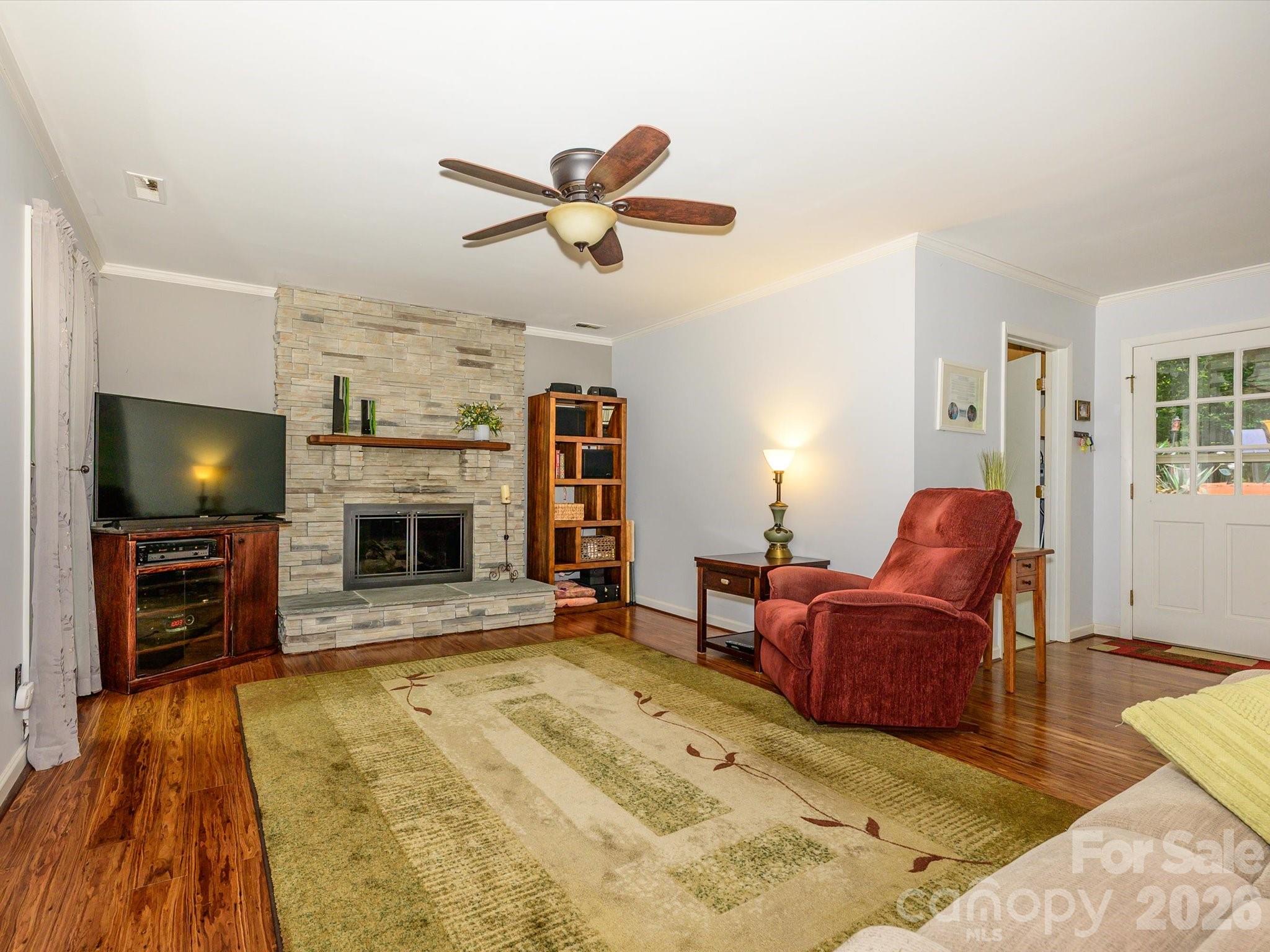 9607 Riddick Place Matthews, NC 28105 - Photo 15 of 39 a living room with furniture and a flat screen tv