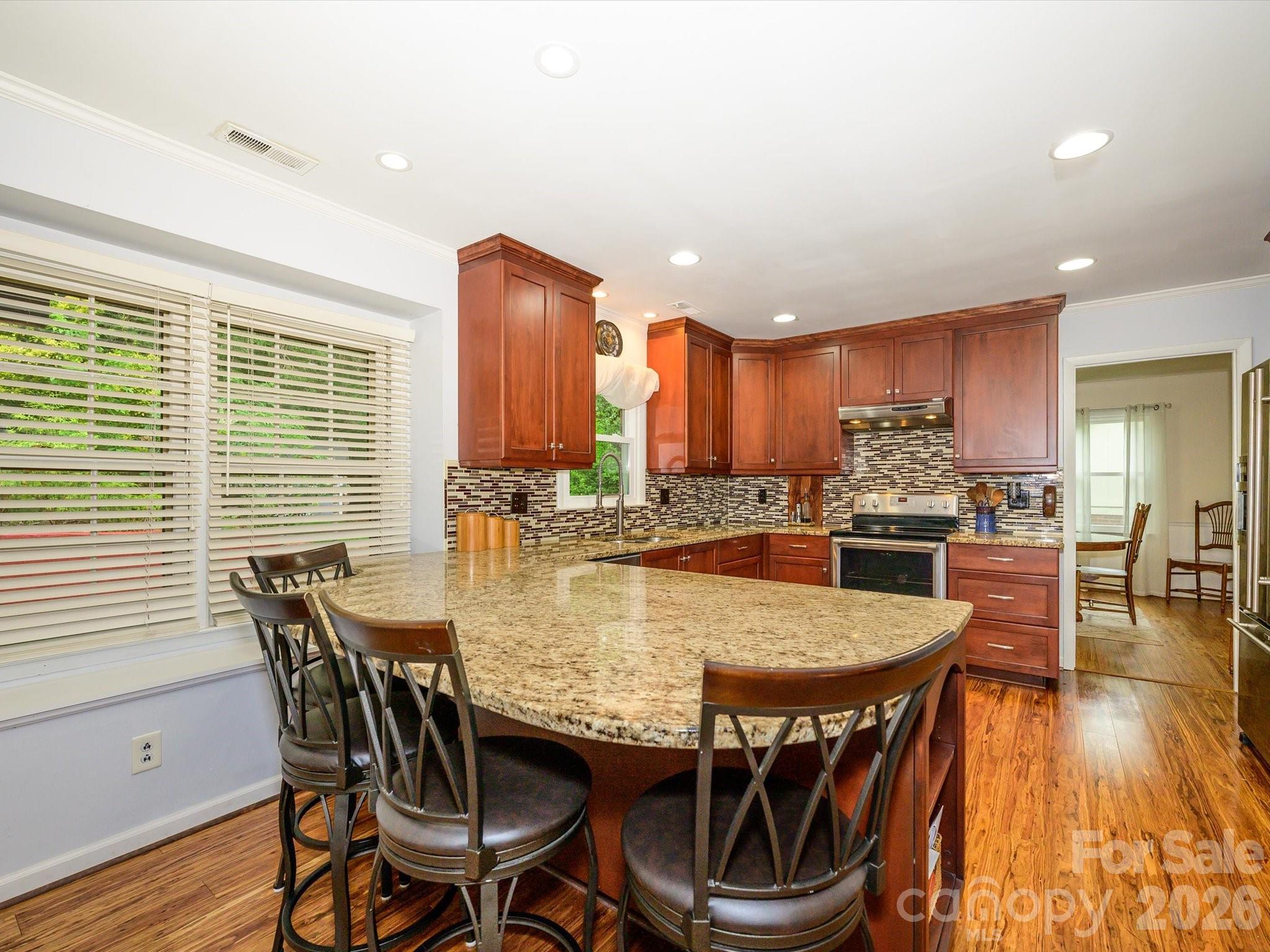 9607 Riddick Place Matthews, NC 28105 - Photo 18 of 39 a dining table with chairs and window