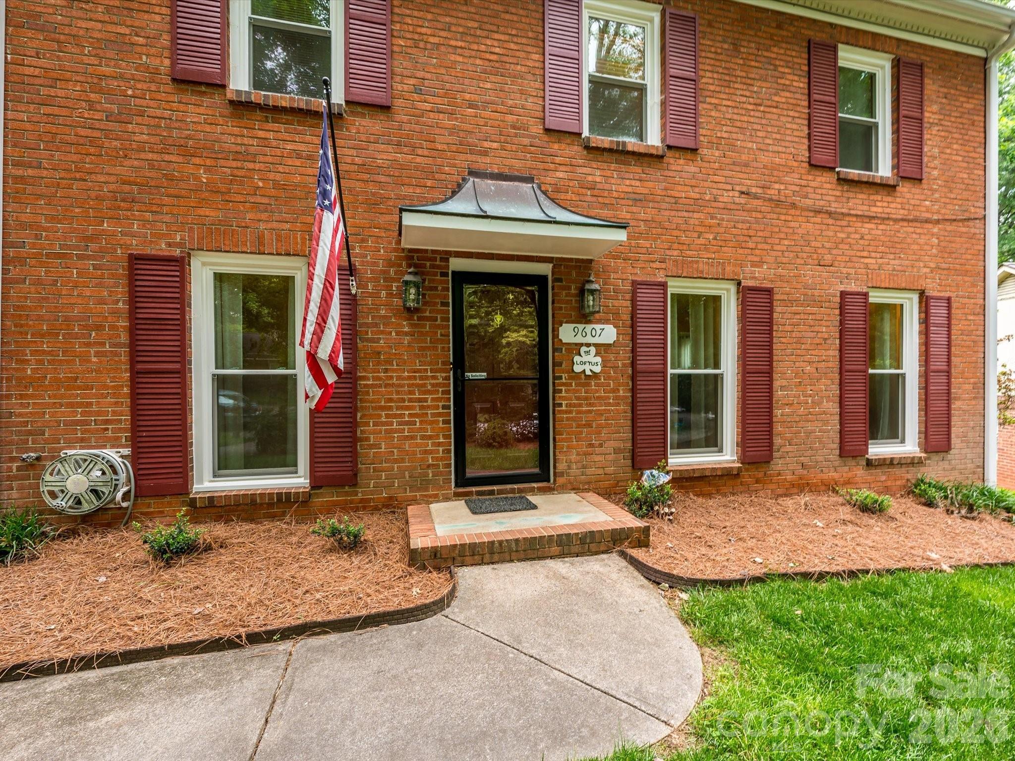 9607 Riddick Place Matthews, NC 28105 - Photo 2 of 39 a front view of a house