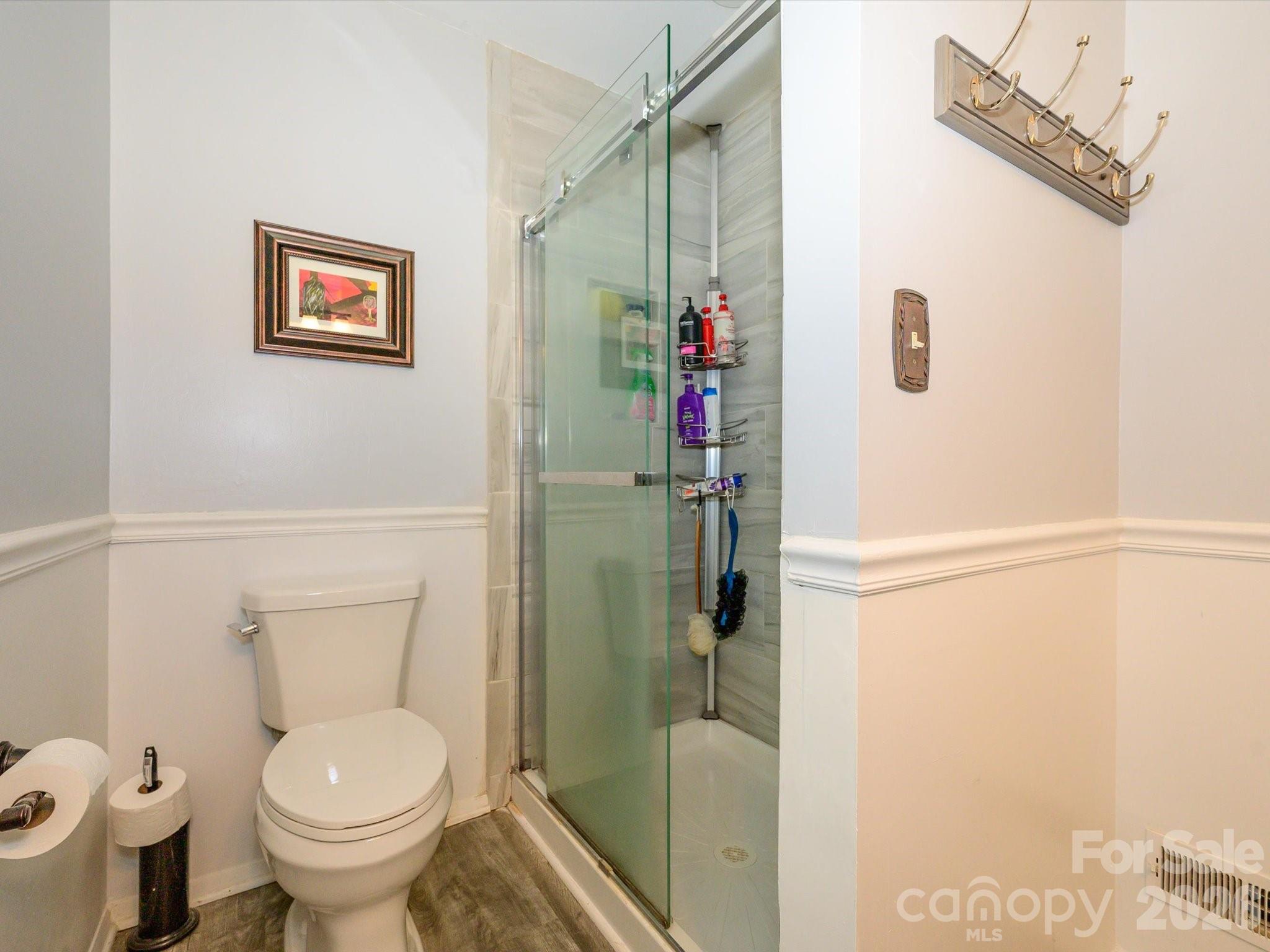 9607 Riddick Place Matthews, NC 28105 - Photo 27 of 39 a bathroom with a toilet and a shower