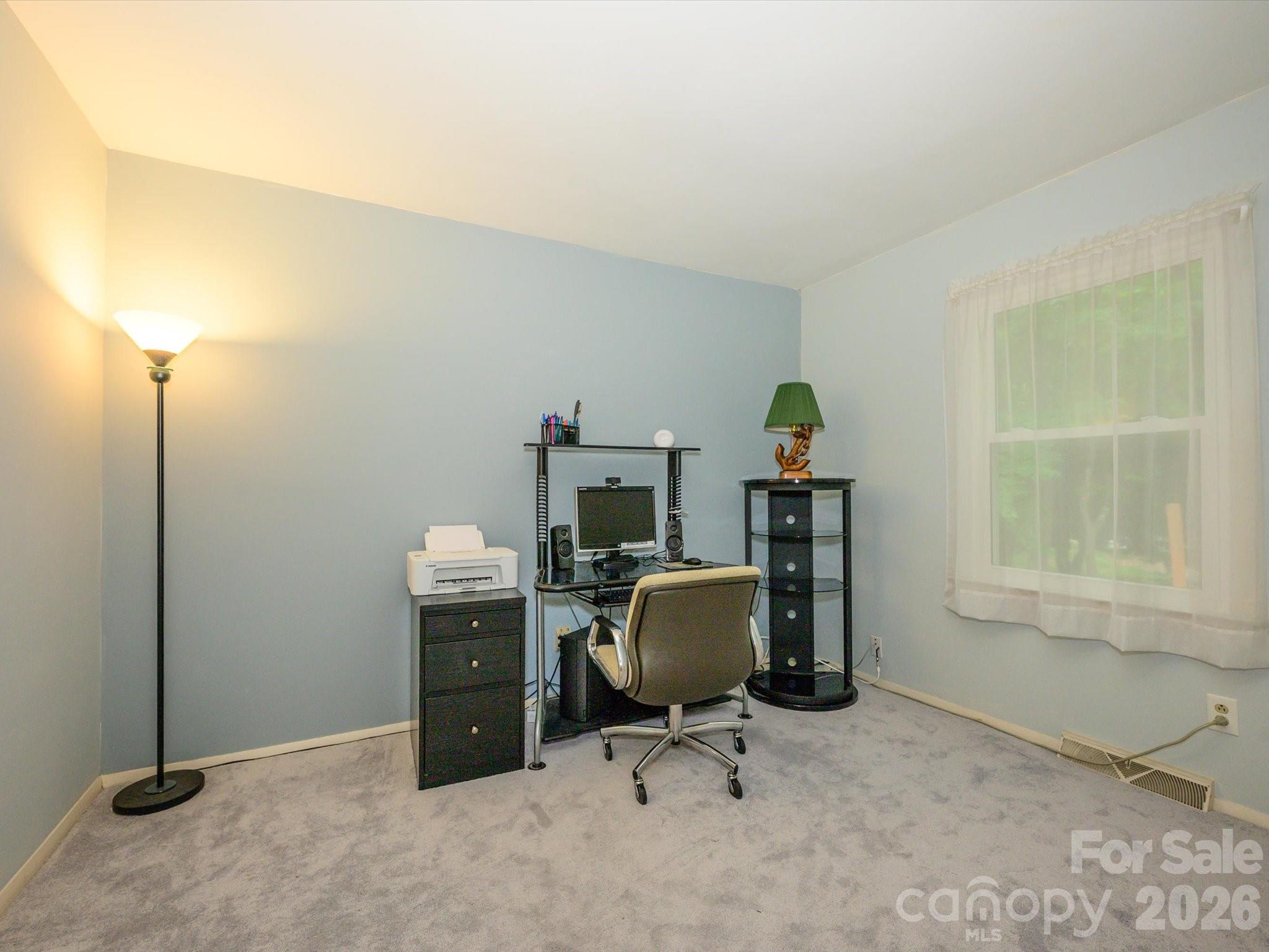 9607 Riddick Place Matthews, NC 28105 - Photo 28 of 39 a view of a workspace with furniture and a window