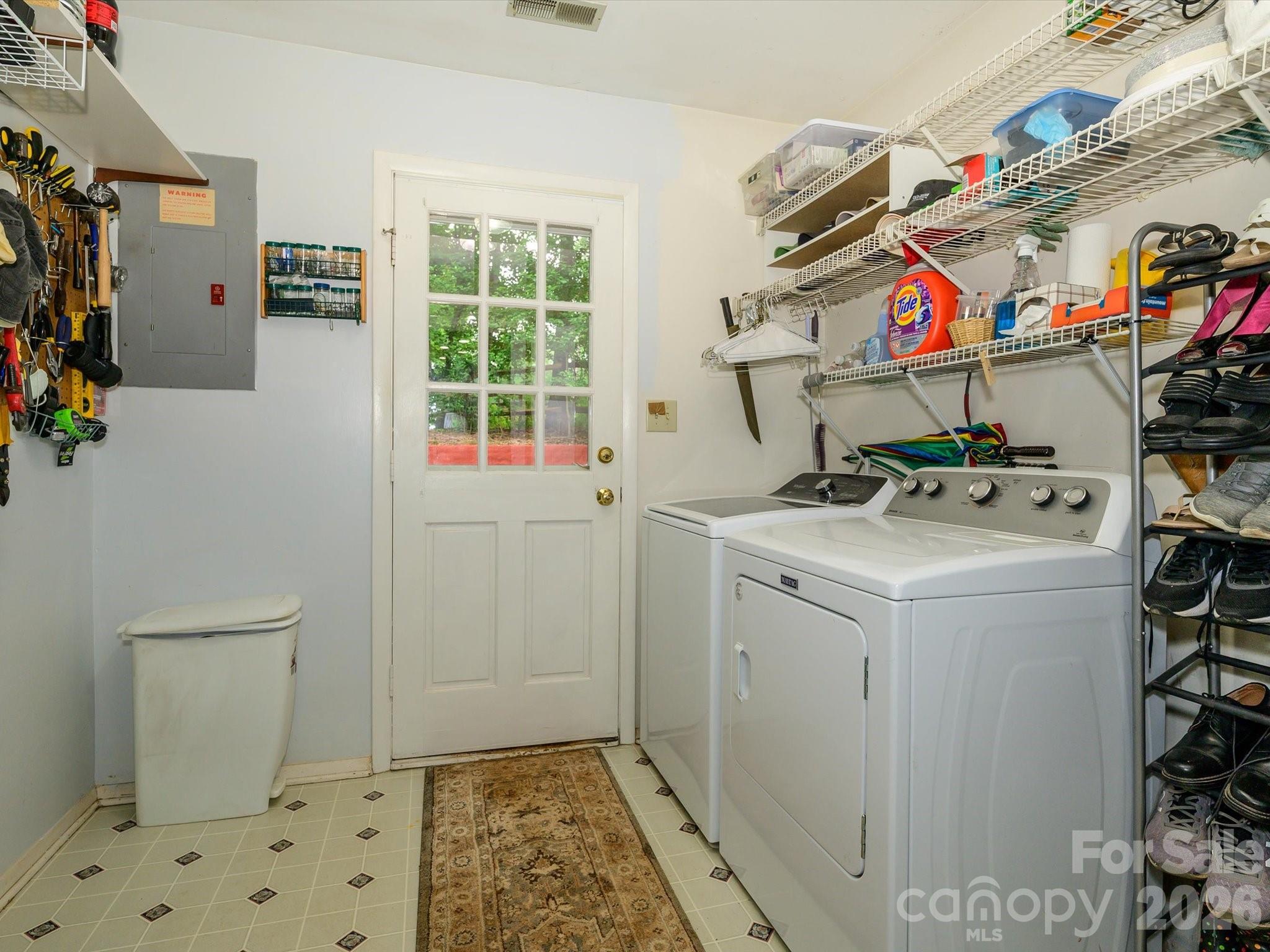 9607 Riddick Place Matthews, NC 28105 - Photo 32 of 39 a utility room with dryer and washer