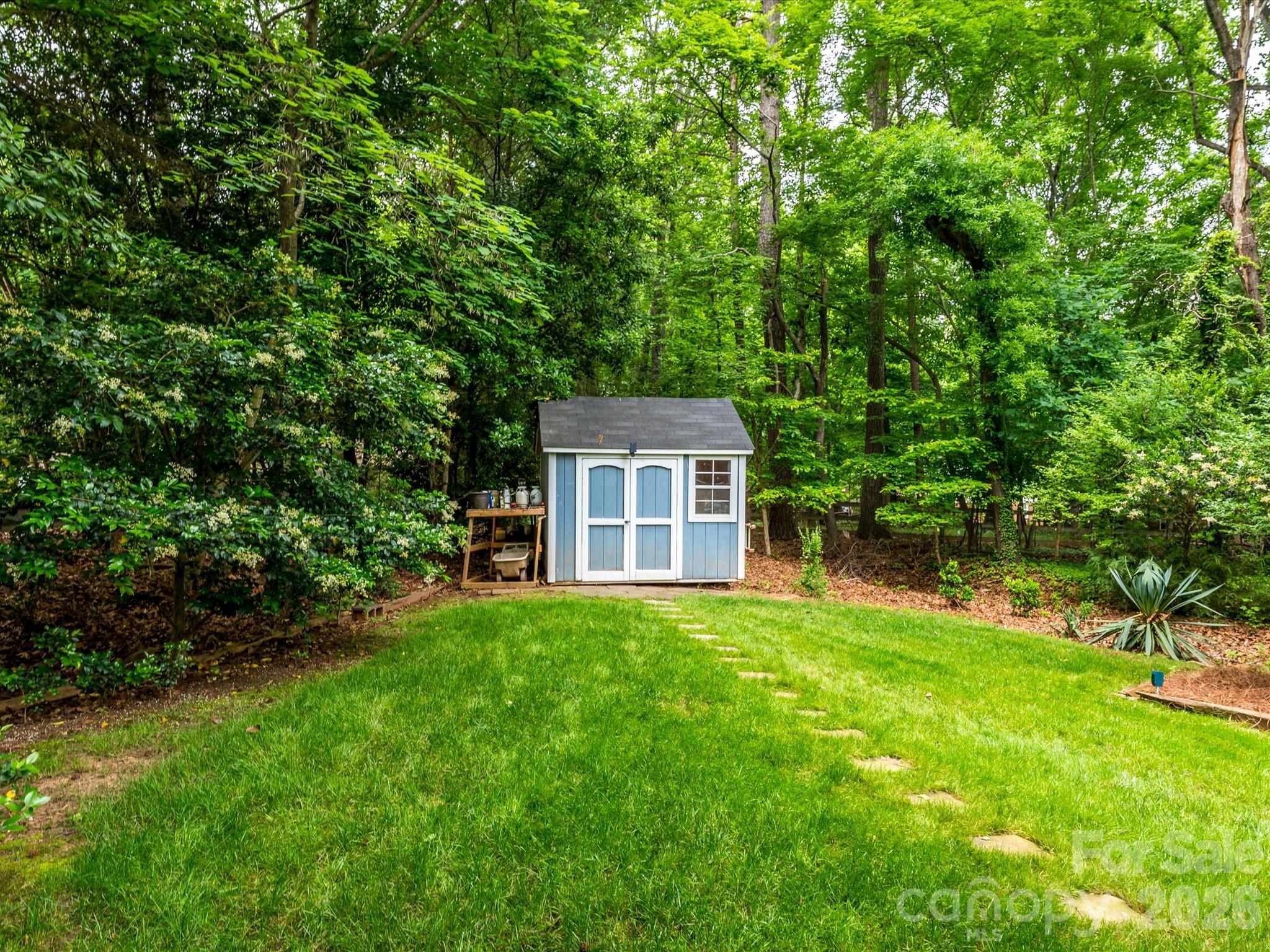 9607 Riddick Place Matthews, NC 28105 - Photo 35 of 39 a view of a house with a yard