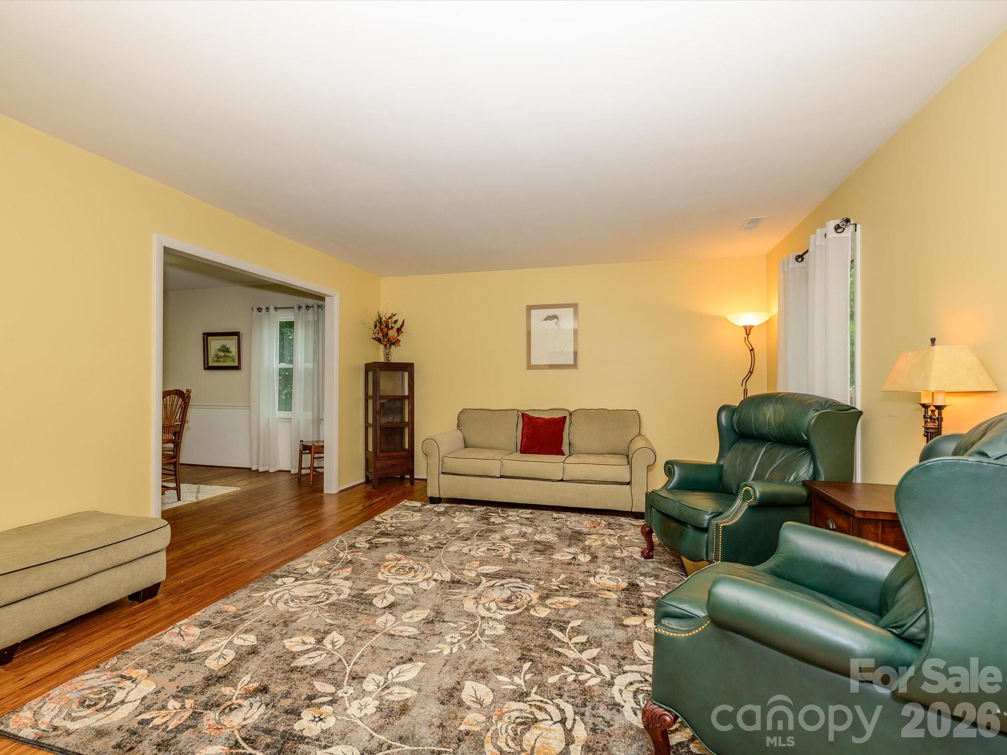 9607 Riddick Place Matthews, NC 28105 - Photo 7 of 39 a bedroom with furniture and a rug