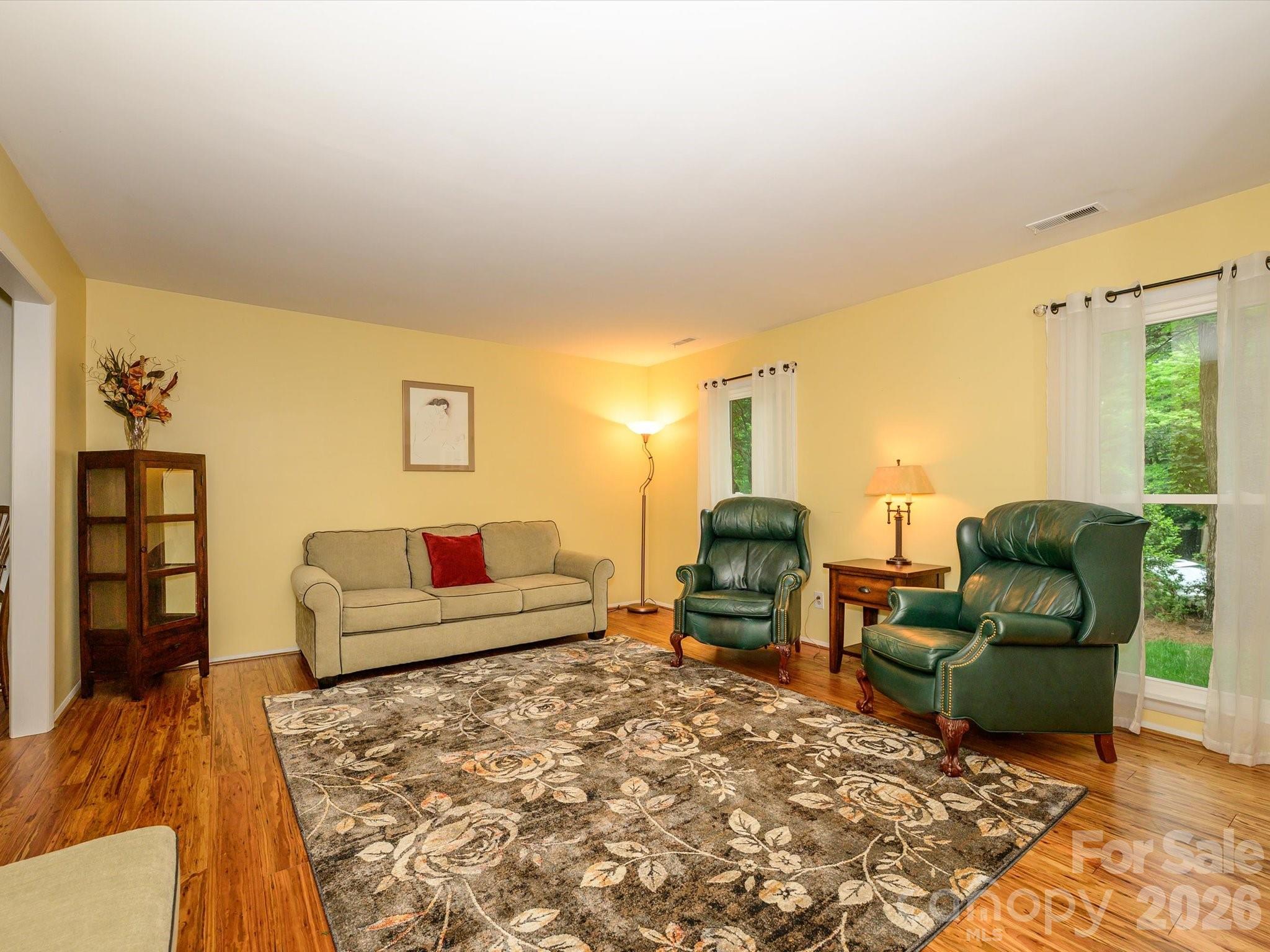 9607 Riddick Place Matthews, NC 28105 - Photo 8 of 39 a living room with furniture and a couch