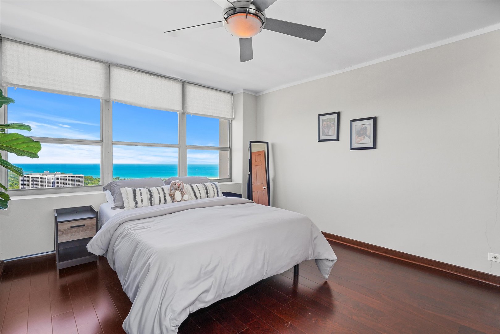 655 West Irving Park Road, Unit 3916 Chicago, IL 60613 - Photo 11 of 17 a bedroom with a bed and a window