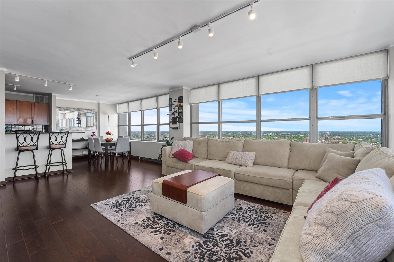 655 West Irving Park Road, Unit 3916 Chicago, IL 60613 - Photo 5 of 17 a living room with furniture and a table