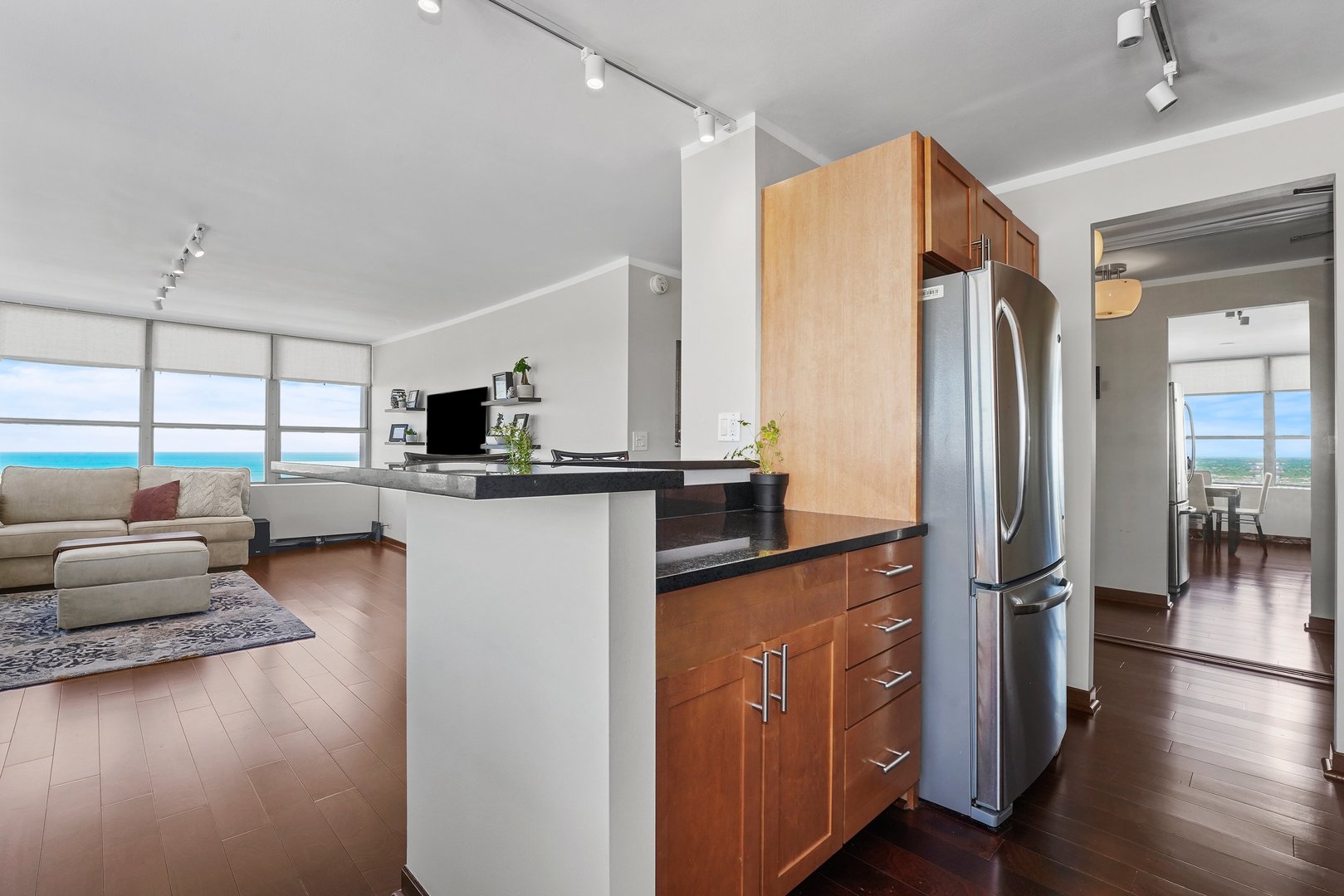 655 West Irving Park Road, Unit 3916 Chicago, IL 60613 - Photo 7 of 17 a kitchen with stainless steel appliances granite countertop a refrigerator and a stove
