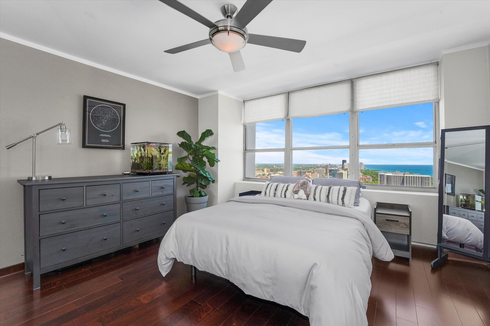 655 West Irving Park Road, Unit 3916 Chicago, IL 60613 - Photo 9 of 17 a bedroom with a large bed and a large window