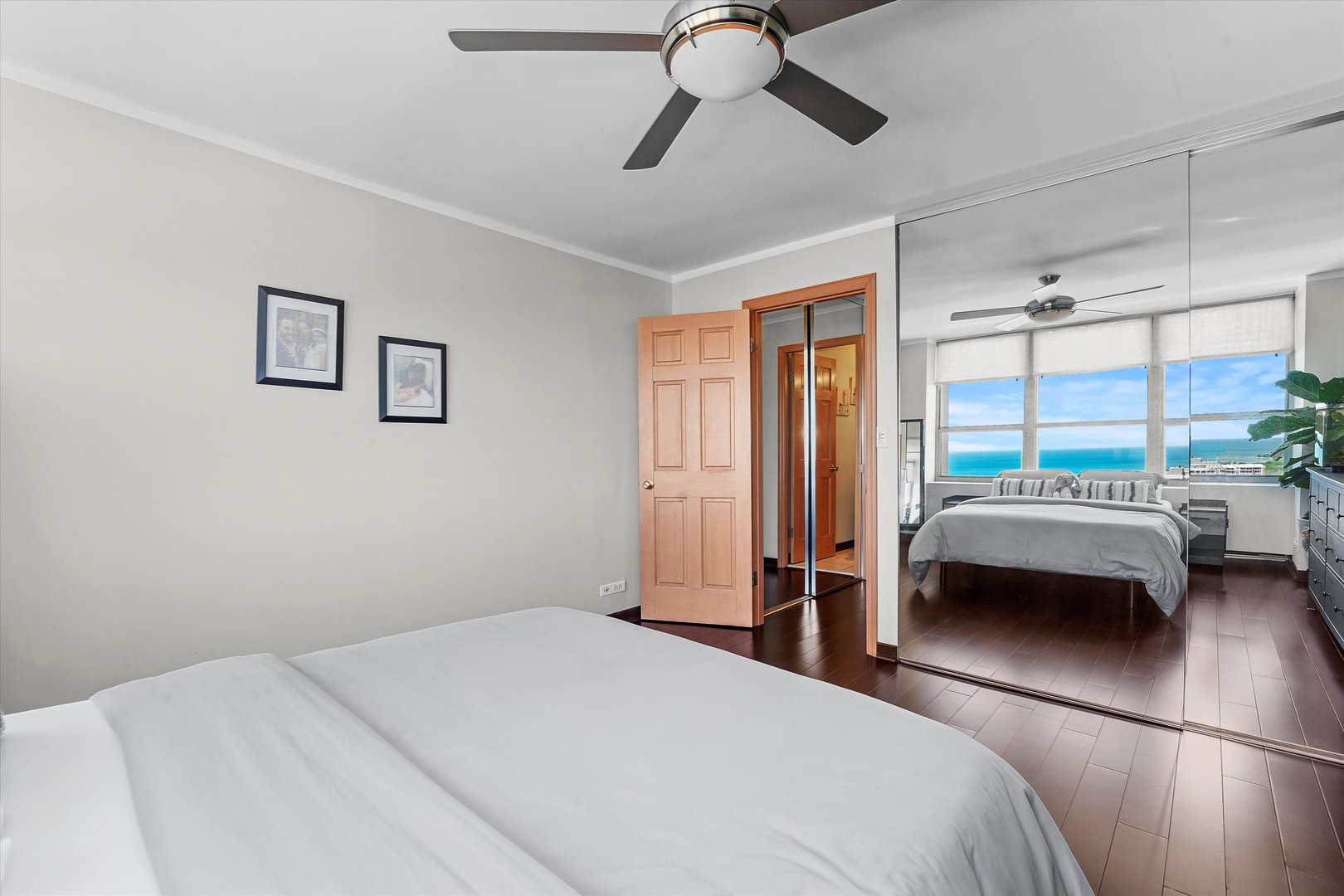 655 West Irving Park Road, Unit 3916 Chicago, IL 60613 - Photo 10 of 17 a bedroom with a bed and a large window