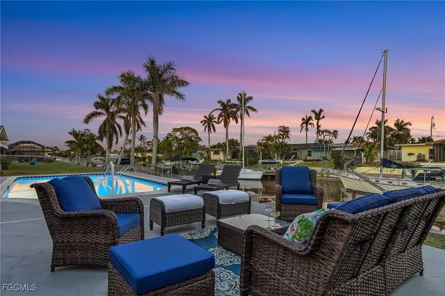 a view of a patio with couches chairs and a table