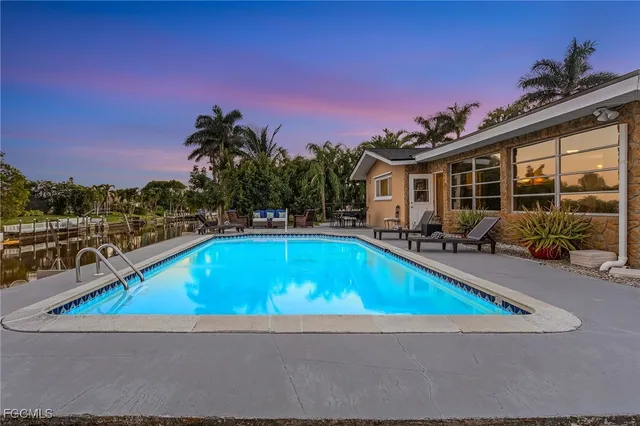 a small pool with outdoor seating