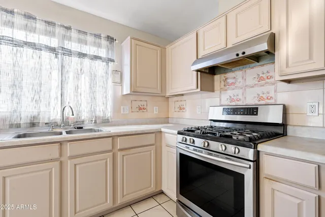 a view of a kitchen with furniture and a fireplace