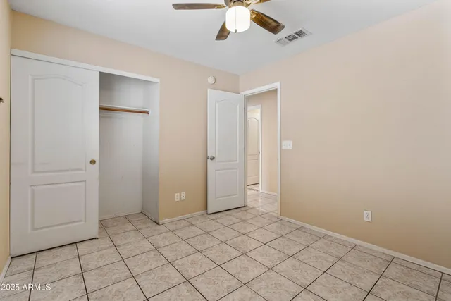 a view of a bathroom from the hallway with toilet