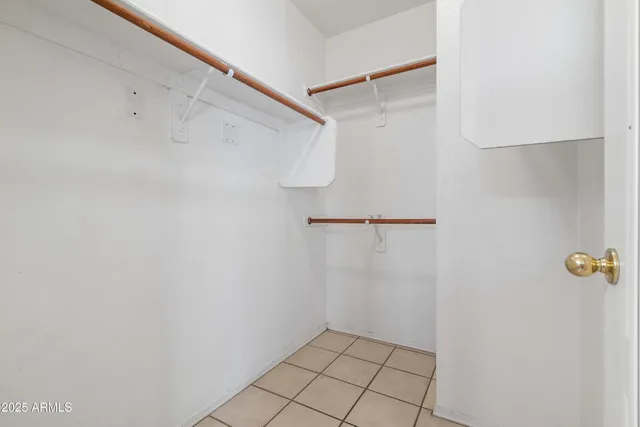 a pathway of a house with a yard