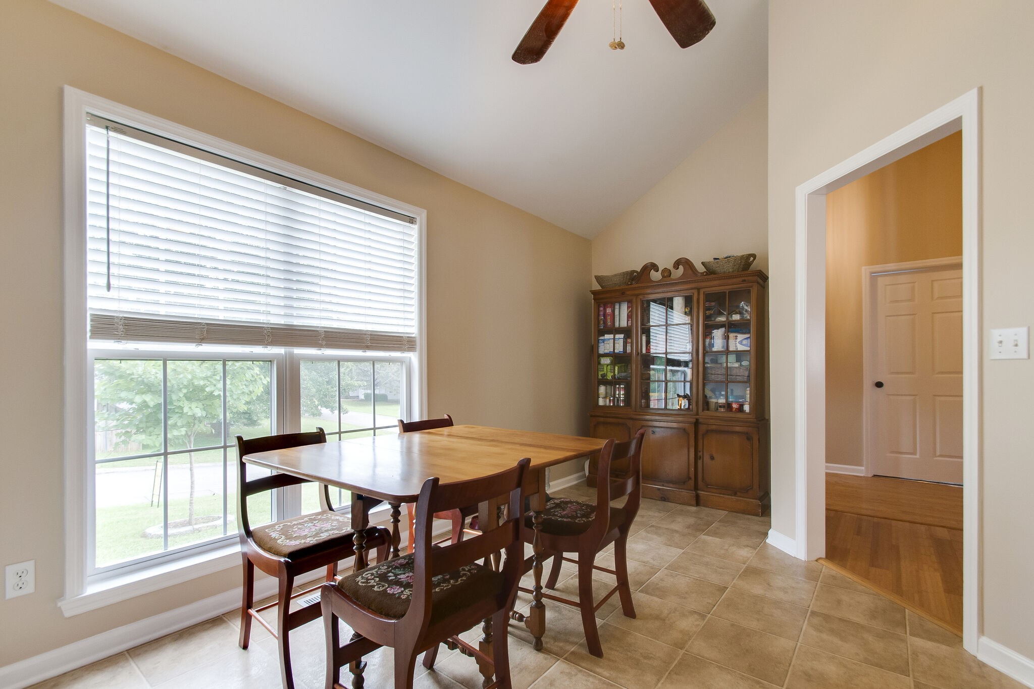 7487 Christopher Street Fairview, TN 37062 - Photo 16 of 27 a view of a dining room with furniture and a window
