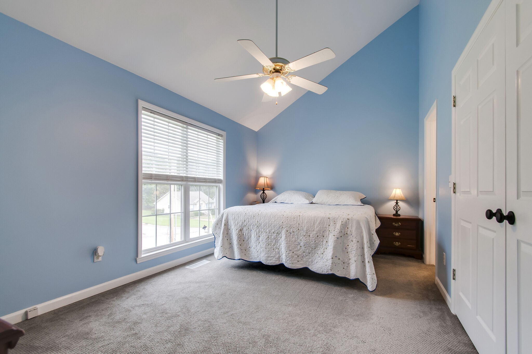 7487 Christopher Street Fairview, TN 37062 - Photo 17 of 27 a bedroom with a bed and a window