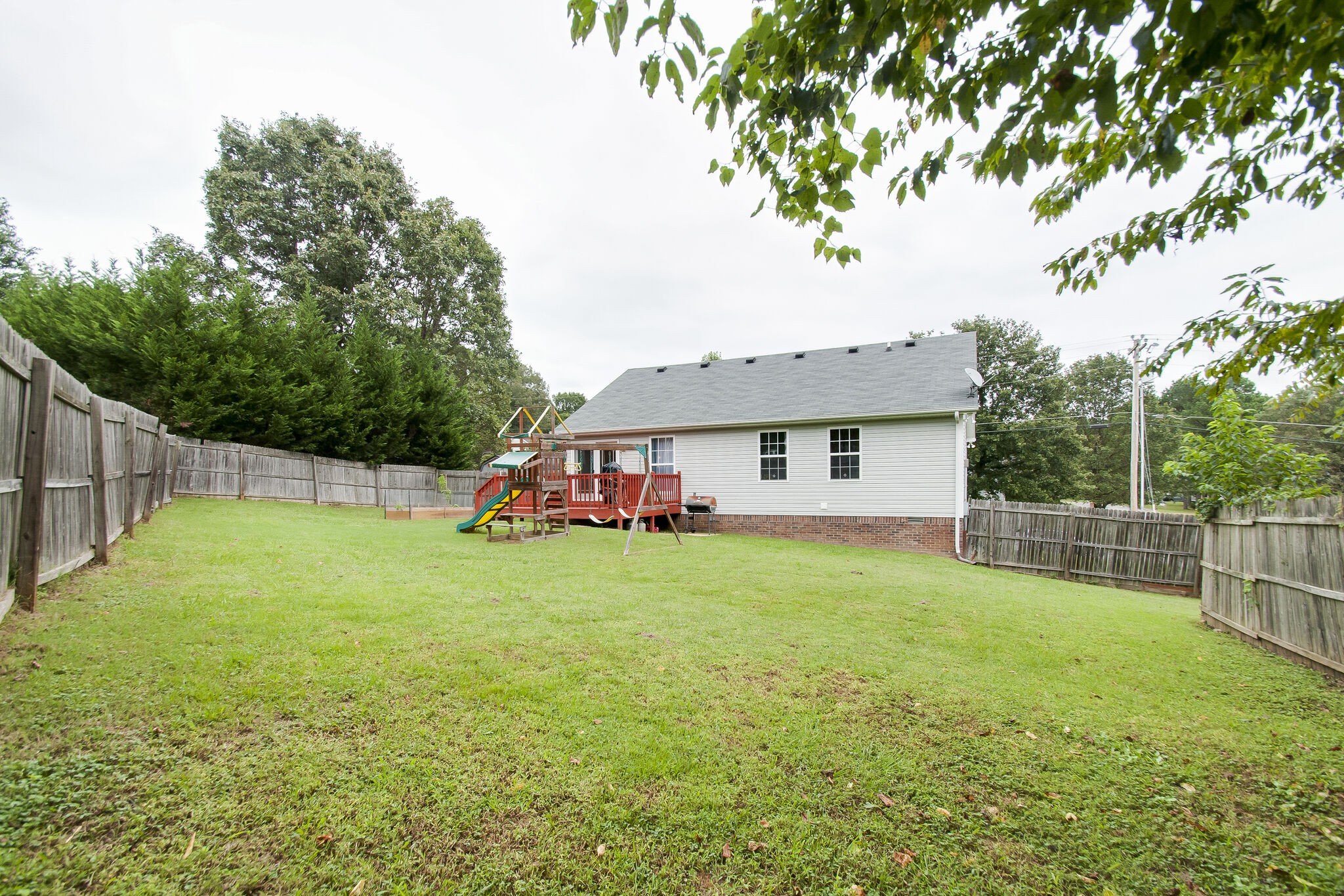 7487 Christopher Street Fairview, TN 37062 - Photo 27 of 27 a view of a house with a yard and sitting area