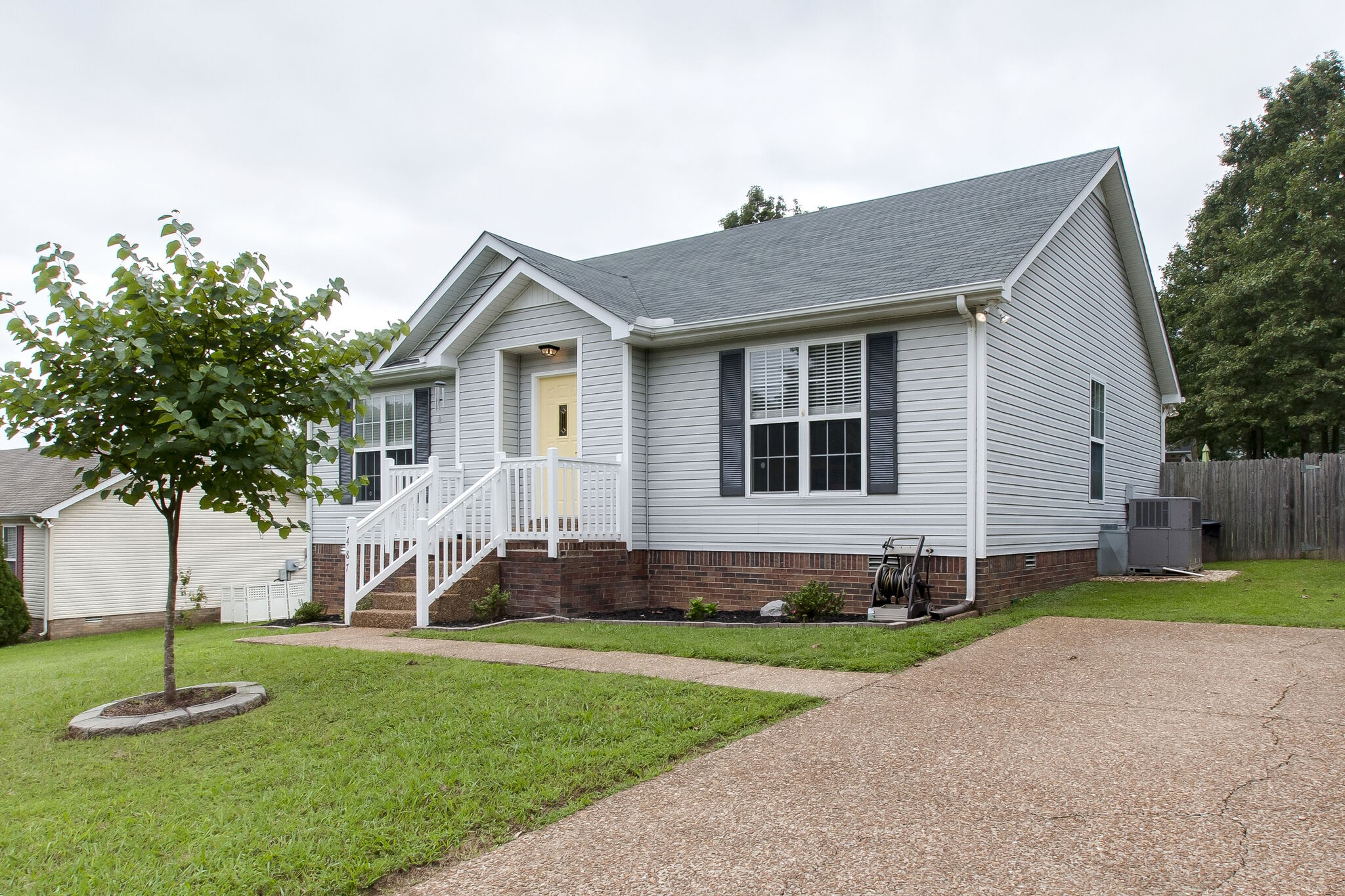 7487 Christopher Street Fairview, TN 37062 - Photo 3 of 27 a front view of a house with a yard
