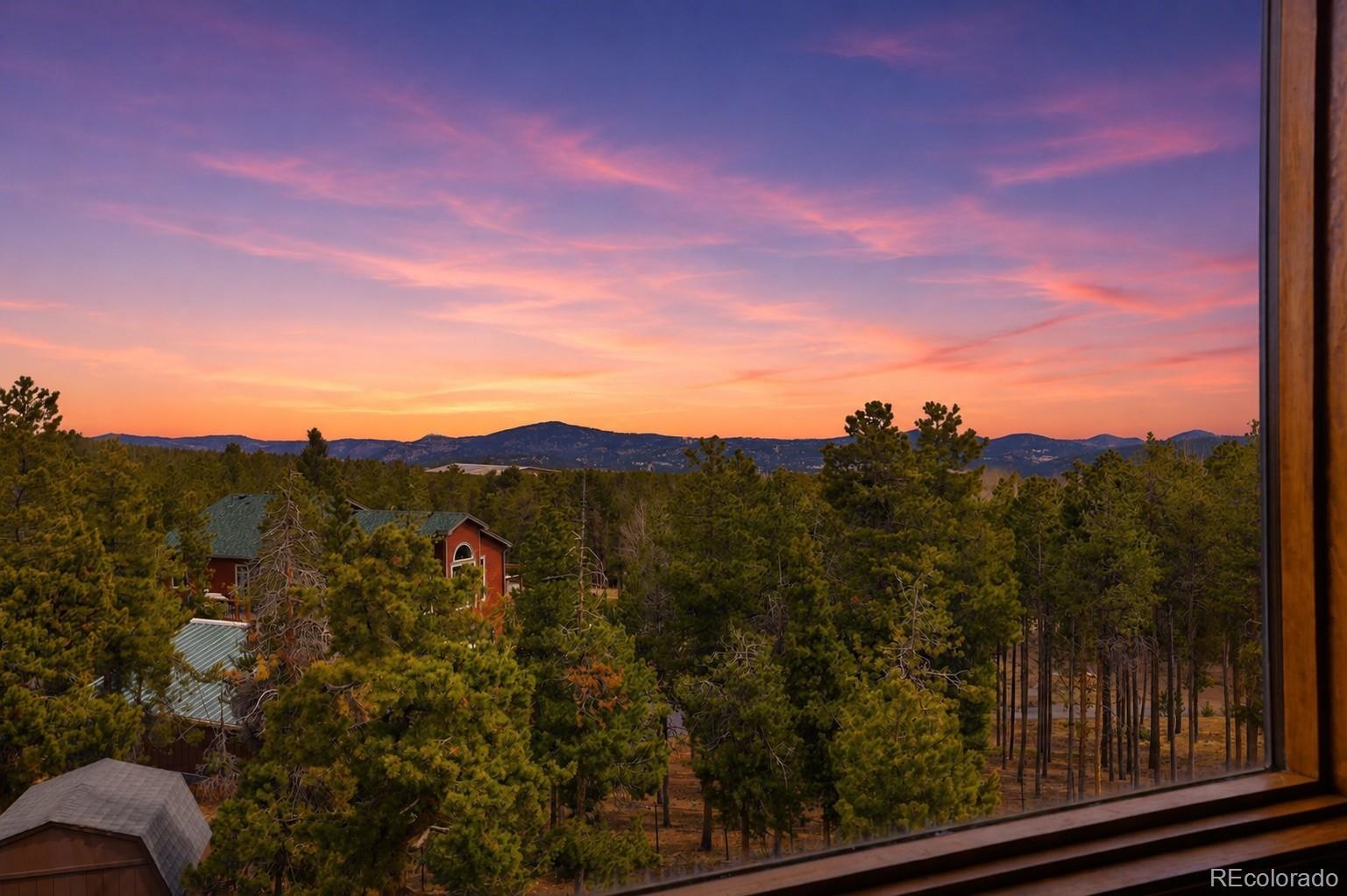 9225 Sandy Lane Conifer, CO 80433 - Photo 21 of 45 a view of a city from a window