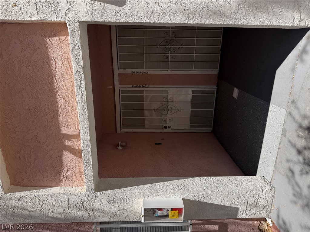 2236 East Desert Inn Road Las Vegas, NV 89169 - Photo 3 of 34 Secure window wells feature ornate security bars, ensuring peace of mind.