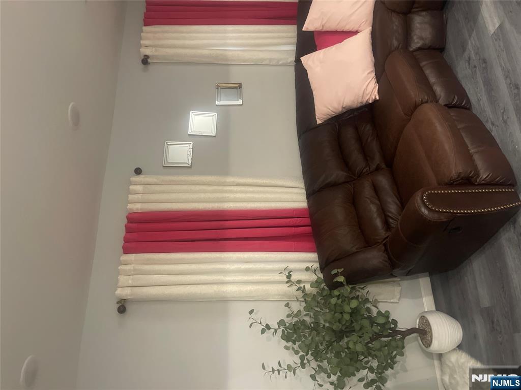 154 Butler Street Paterson, NJ 07524 - Photo 14 of 26 a living room with furniture and a potted plant