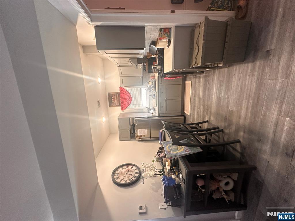 154 Butler Street Paterson, NJ 07524 - Photo 17 of 26 a kitchen with granite countertop a sink cabinets and stainless steel appliances