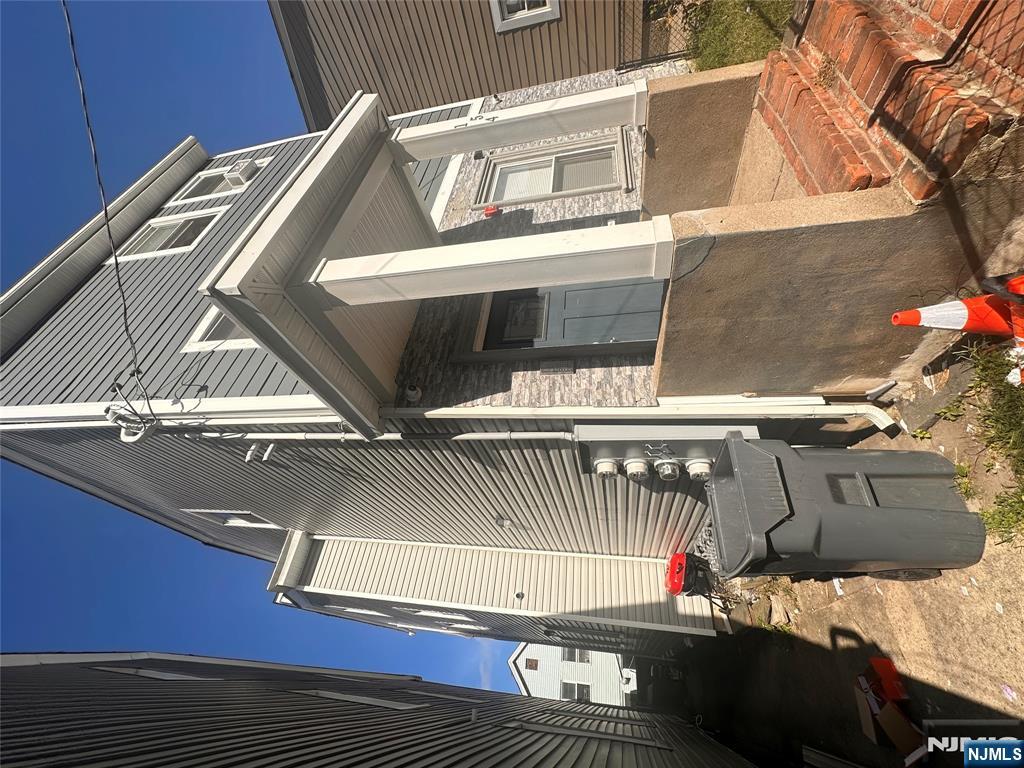 154 Butler Street Paterson, NJ 07524 - Photo 2 of 26 a view of a house with a door