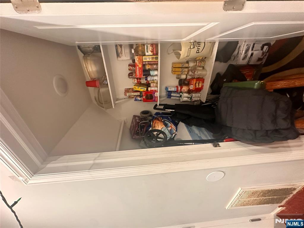 154 Butler Street Paterson, NJ 07524 - Photo 23 of 26 a room with storage and utility