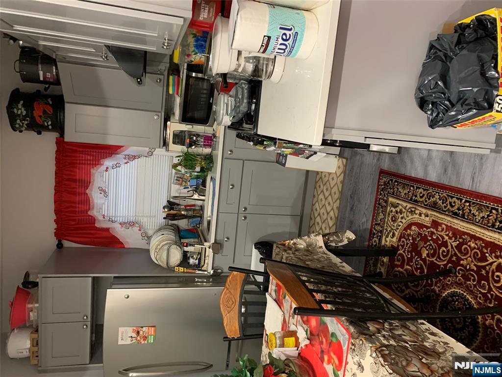 154 Butler Street Paterson, NJ 07524 - Photo 4 of 26 a room with storage and utility