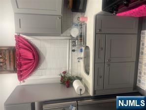 154 Butler Street Paterson, NJ 07524 - Photo 5 of 26 a bathroom with a sink and a mirror