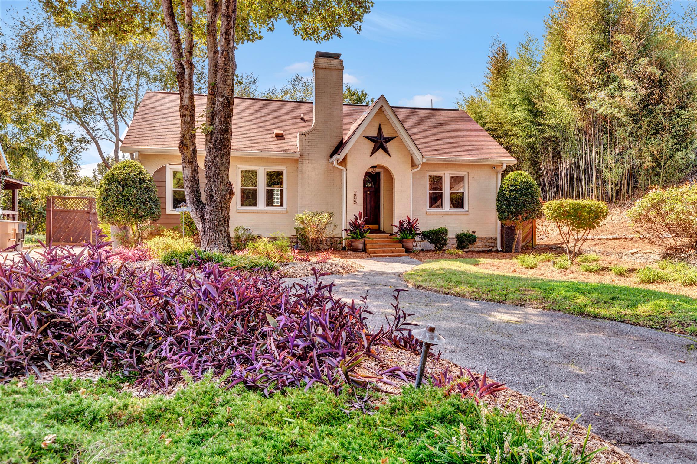 a front view of a house with garden