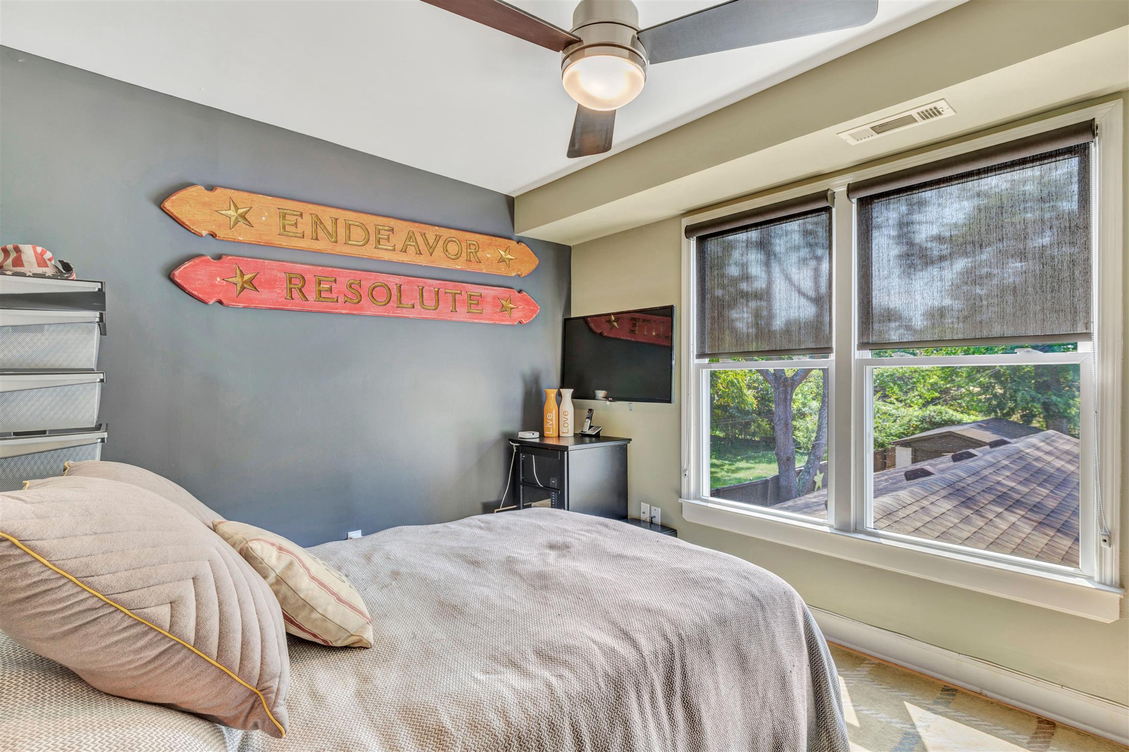 255 Cherokee Road Nashville, TN 37205 - Photo 20 of 30 a bedroom with a bed and a large window with the outer view