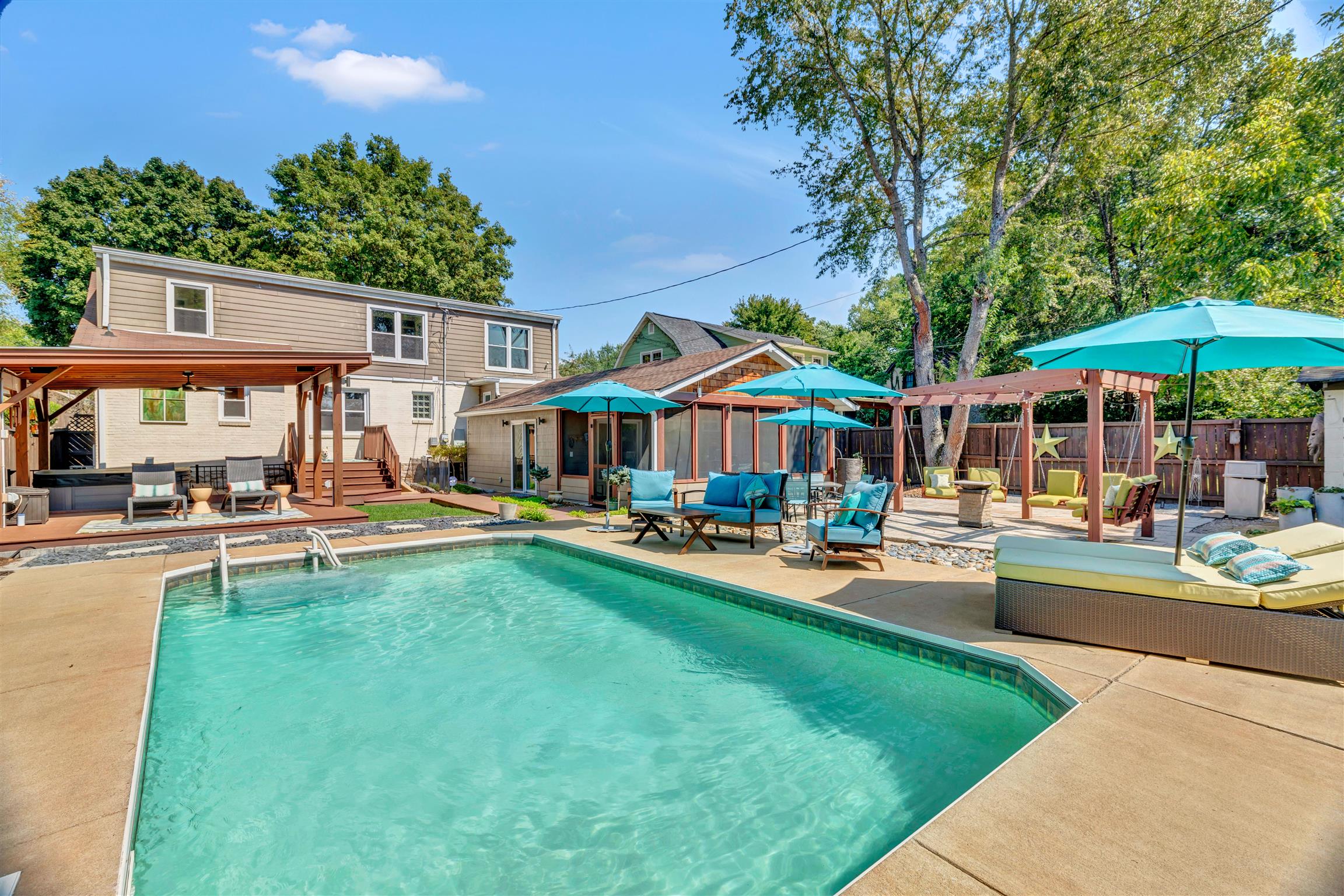 255 Cherokee Road Nashville, TN 37205 - Photo 2 of 30 a view of a house with swimming pool and sitting area