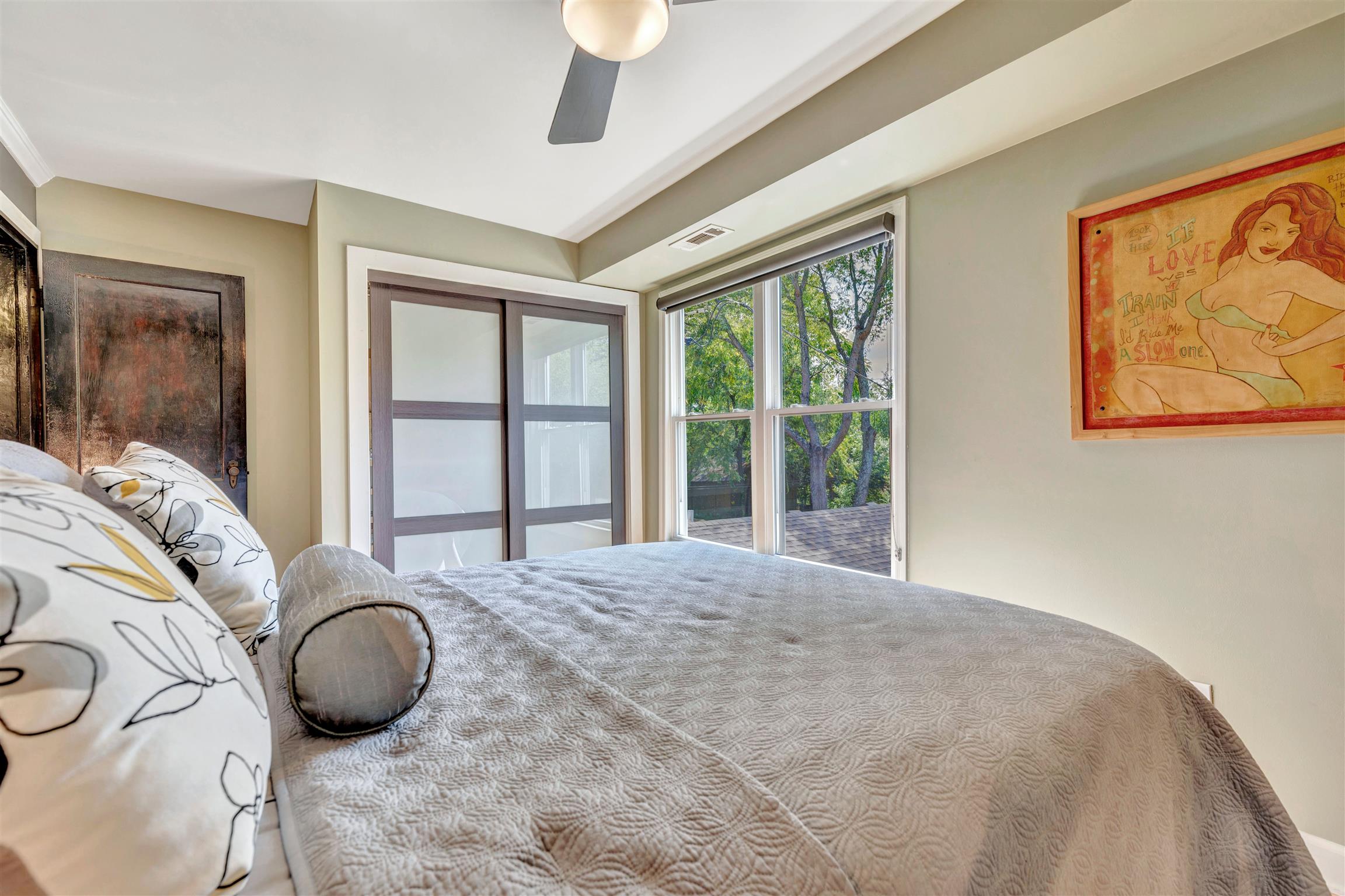 255 Cherokee Road Nashville, TN 37205 - Photo 22 of 30 a large bedroom with a bed and a large window