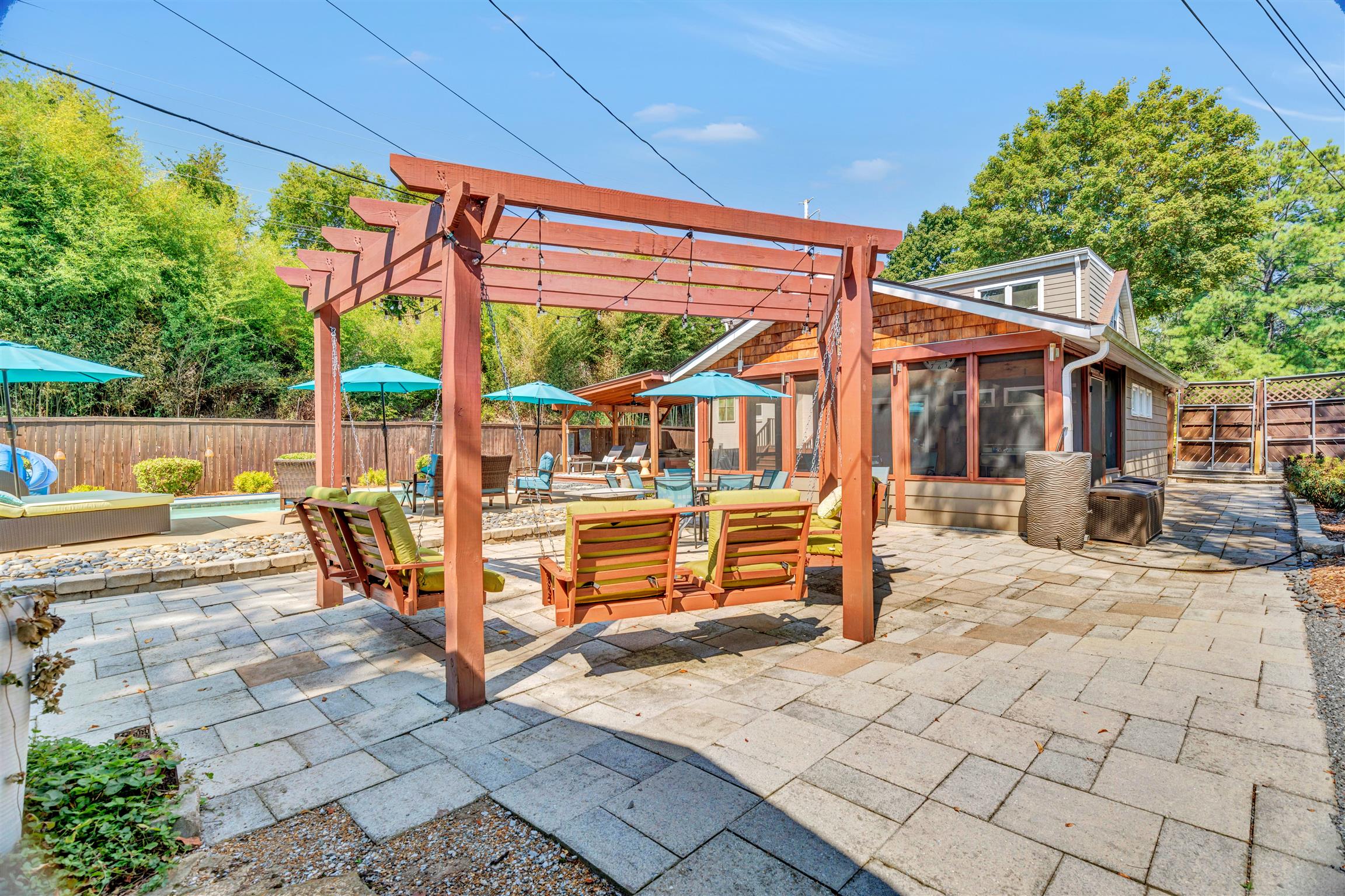 255 Cherokee Road Nashville, TN 37205 - Photo 28 of 30 a view of a patio with a table and chairs under an umbrella