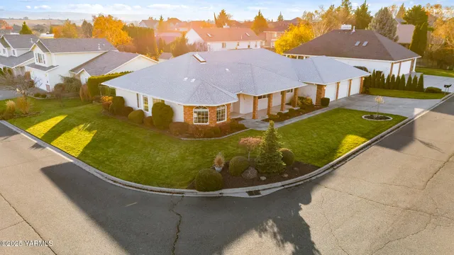 a view of a swimming pool with lounge chairs in patio