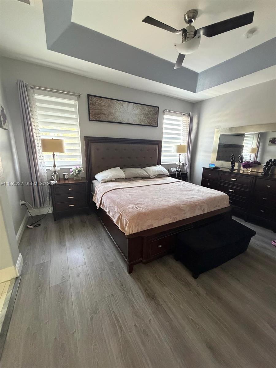 10837 Southwest 242nd Street Homestead, FL 33032 - Photo 12 of 19 a bedroom with a bed and window