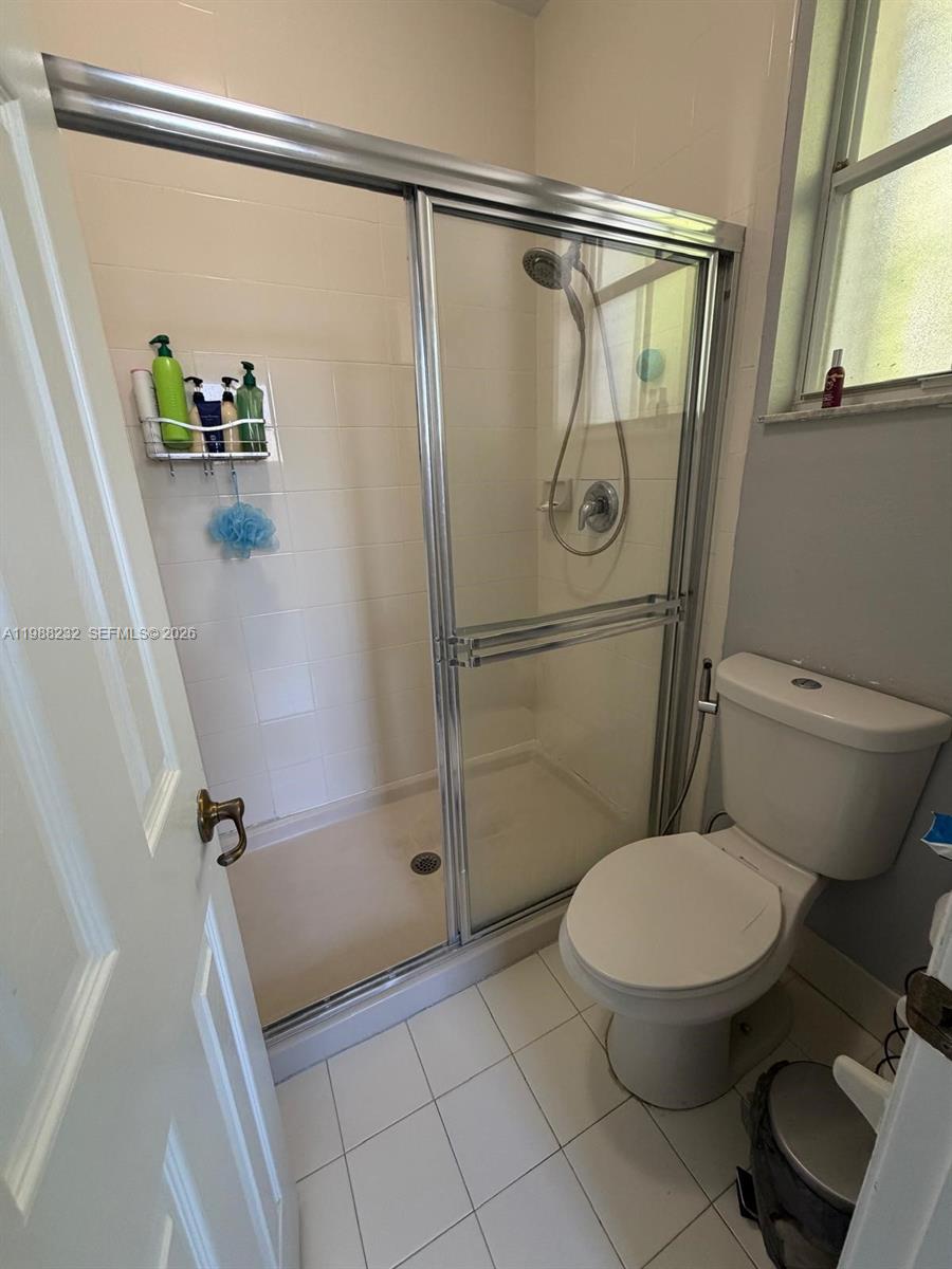 10837 Southwest 242nd Street Homestead, FL 33032 - Photo 13 of 19 a bathroom with a toilet and a shower
