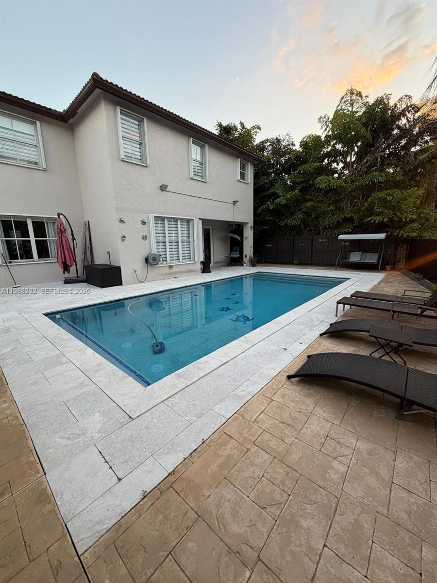 10837 Southwest 242nd Street Homestead, FL 33032 - Photo 18 of 19 a view of a house with a patio