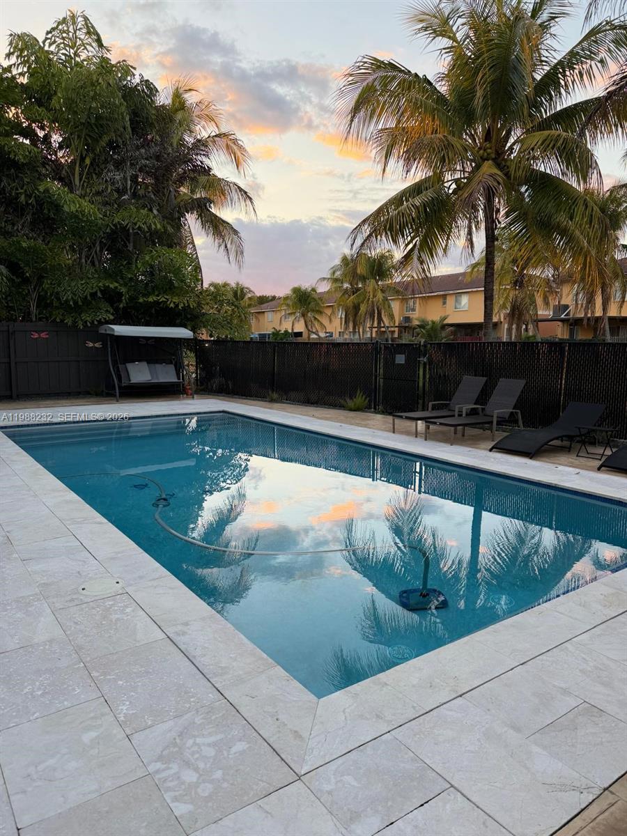 10837 Southwest 242nd Street Homestead, FL 33032 - Photo 19 of 19 a view of swimming pool with a lounge chairs