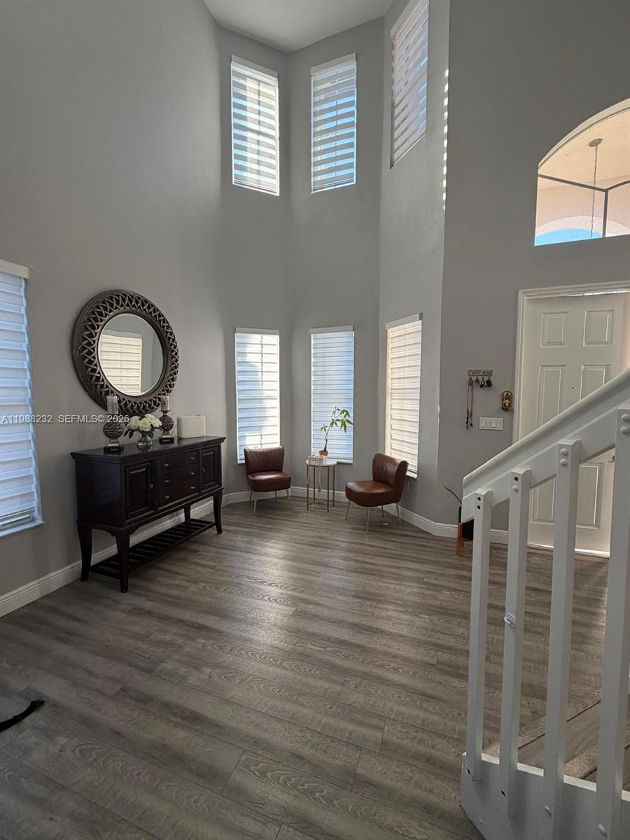 10837 Southwest 242nd Street Homestead, FL 33032 - Photo 3 of 19 a living room with furniture and a wooden floor