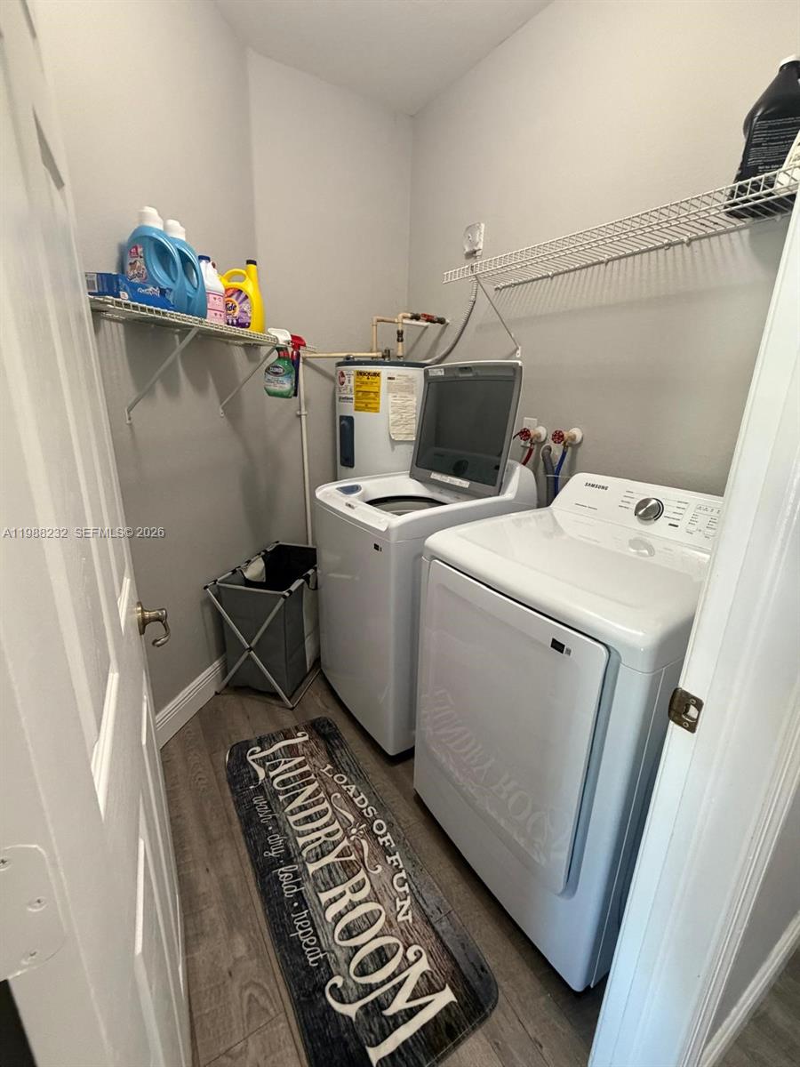 10837 Southwest 242nd Street Homestead, FL 33032 - Photo 7 of 19 a utility room with dryer and washer