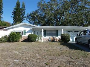 4392 Craftsbury Drive New Port Richey, FL 34652 - Photo 1 of 41 a view of a house with a patio